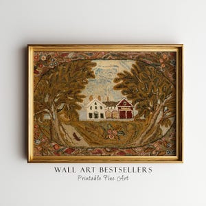 Op de afbeelding: Een ingelijst stuk wandkunst met een landelijke scène met drie gebouwen, bomen en een bloemenrand. Het kunstwerk zit in een gouden lijst en heeft onderaan de tekst "WALL ART BESTSELLERS Printable Fine Art".
