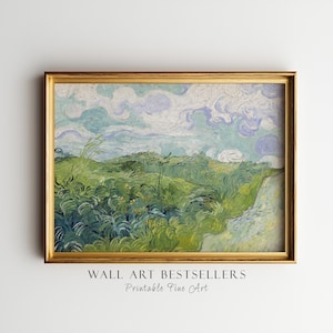 May include: A framed landscape print featuring a green grassy field under a swirling sky with light blue and white clouds. The artwork is enclosed in a metallic gold frame. Below the frame, the text reads WALL ART BESTSELLERS Printable Fine Art.