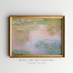 May include: A framed wall art print featuring an impressionist painting of a pond with pink water lilies and green lily pads. The artwork displays soft pastel tones of blue, green, and pink. The text WALL ART BESTSELLERS Printable Fine Art appears below.