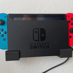 Väggfäste för Nintendo Switch spelkonsol dockningsswitch väggfäste