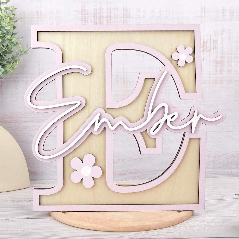 May include: A set of three ceramic mugs with a speckled, matte finish. The mugs are in shades of cream, light brown, and dark brown. Each mug has a simple, minimalist design and a rounded handle.