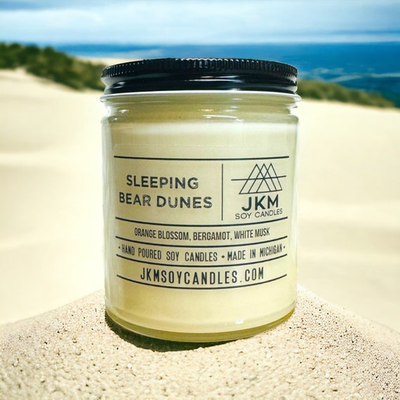 Sleeping Bear Dunes candle in a dark glass jar
