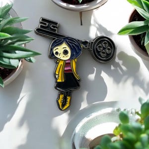 Coraline Inspired Key Enamel Pin | Button Eyes Ghost Girl Yellow Raincoat | Movie Collectible | Cute Horror Character Accessory | Halloween