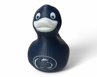 May include: A blue rubber duck with a white face and a white Nittany Lion logo on the chest.