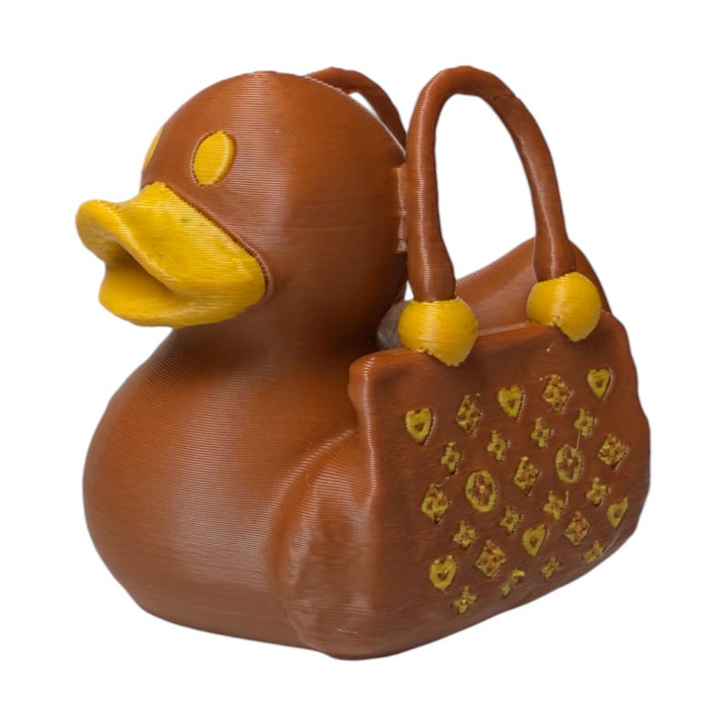 Mini purse-themed duck collectible for glam lovers