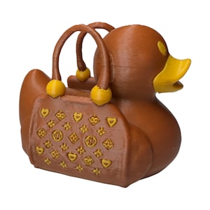 Purse Duck styled like a luxury handbag with gold buckle detail