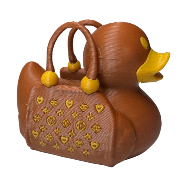 Purse Duck styled like a luxury handbag with gold buckle detail