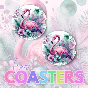 May include: Two pink flamingo coasters with watercolor floral designs. The coasters are round and feature pink flamingos with green leaves and pink flowers.
