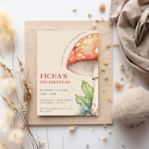 May include: A beige invitation card with a red and white mushroom illustration. The text on the card reads "Fiona's 7th Birthday", "Sunday 12 June 1PM - 3PM", "Our House, 1 High Street Tenterden, TN3 4FT", "RSVP to Helen 07147 147123 by 1 June".