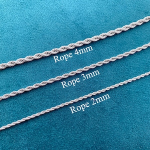 May include: Three silver-colored rope chains, each with a different thickness, are displayed against a teal background. The chains are labeled "Rope 4mm", "Rope 3mm", and "Rope 2mm". The chains are likely for jewelry making or crafting.