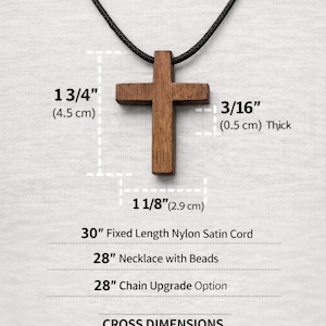 May include: A wooden cross pendant on a black cord necklace. The cross is approximately 1 3/4 inches (4.5 cm) long, 1 1/8 inches (2.9 cm) wide, and 3/16 inches (0.5 cm) thick. The necklace options include a 30-inch fixed-length nylon cord.