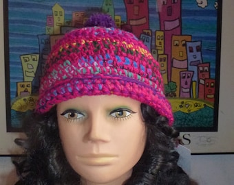 Handgehaakte veelkleurige beanie met pompon