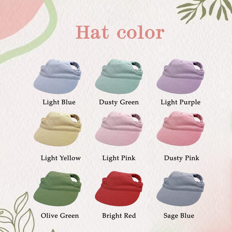 May include: A collection of nine ribbed fabric visors arranged in a grid, labeled with colors: Light Blue, Dusty Green, Light Purple, Light Yellow, Light Pink, Dusty Pink, Olive Green, Bright Red, and Sage Blue. Each visor features an open top.