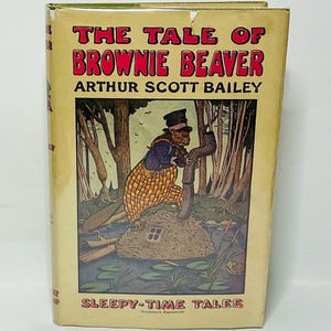May include: A vintage hardcover book titled "The Tale of Brownie Beaver" by Arthur Scott Bailey. The cover features an illustration of a beaver in a hat and overalls, with a forest backdrop. The book is part of the "Sleepy-Time Tales" series.