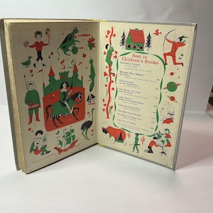 May include: An open hardcover book titled Best in Children's Books with illustrated endpapers. The left side features a green castle, a person on horseback, and various figures. The right side lists book titles and authors with small drawings.