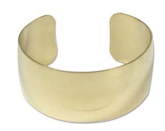 May include: A simple gold-toned metal cuff bracelet.