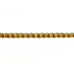 May include: Gold trim with a repeating pattern of swirls and circles.