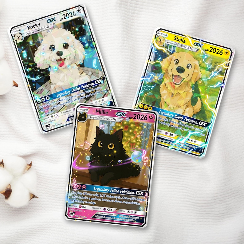 May include: Three collectible trading cards featuring cartoon animals. One card shows a white dog named Rocky, another a golden retriever named Stella, and the third a black cat named Millie. Each card has a GX designation and the year 2026.