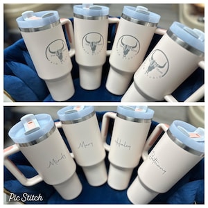 May include: Six pink stainless steel travel mugs with lids. Three mugs have the text "The Mane Hair Studio" and a bull's head logo. Three mugs have personalized names: Mindy, Mary, and Haley.