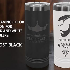 May include: Two insulated tumblers, one black and one white, with silver trim. The black tumbler has a crown and car logo, the white one a barber shop design. Text reads "NEW ENGRAVING COLOR OPTION FOR BLACK AND WHITE TUMBLERS: 'GHOST BLACK'".