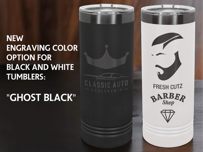 May include: Two insulated tumblers, one black and one white, with silver trim. The black tumbler has a crown and car logo, the white one a barber shop design. Text reads "NEW ENGRAVING COLOR OPTION FOR BLACK AND WHITE TUMBLERS: 'GHOST BLACK'".