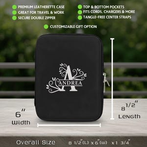 May include: Black leatherette case with a white monogram and the name "Andrea". The case measures 8 1/2" long, 6" wide, and 1 3/4" thick. Features include top and bottom pockets, tangle-free straps, and a secure double zipper. Great for travel and work.