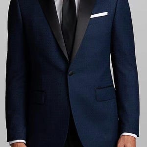May include: A dark blue tuxedo jacket with a black satin lapel and a white pocket square.