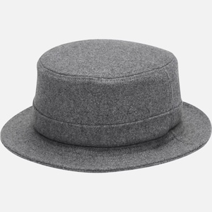 May include: A gray felt bucket hat with a wide brim and a flat top.