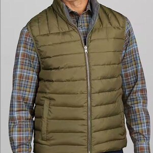 May include: A green quilted vest with a zipper closure and a stand-up collar.