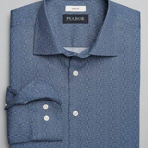 Pode incluir: Uma camisa azul com um padrão branco. A camisa tem um caimento justo e uma gola abotoada. O rótulo na camisa diz "J.S.A. BANK".