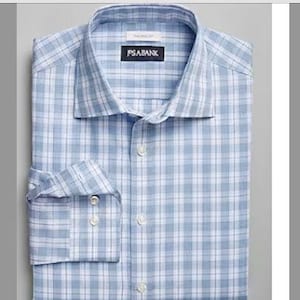 May include: A blue and white plaid dress shirt with a button-down collar and long sleeves. The shirt has the brand name "PSABANK" on the front.
