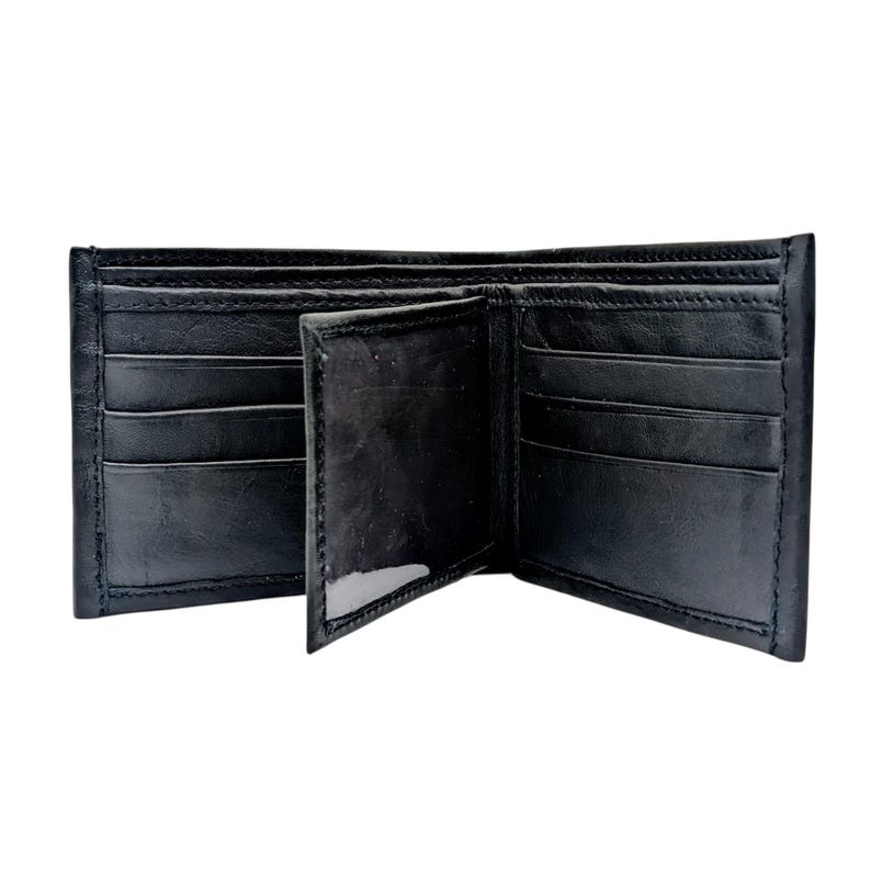 May include: Open black leather wallet with multiple card slots and compartments. The wallet is made of smooth, dark leather and has a classic, minimalist design. The wallet is open, revealing the interior.