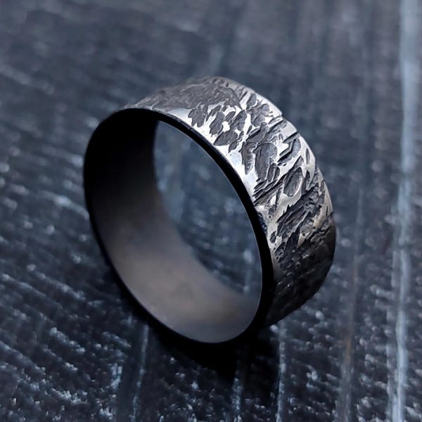 Distressed Black Titanium Ring: Hammered Brutalist Style