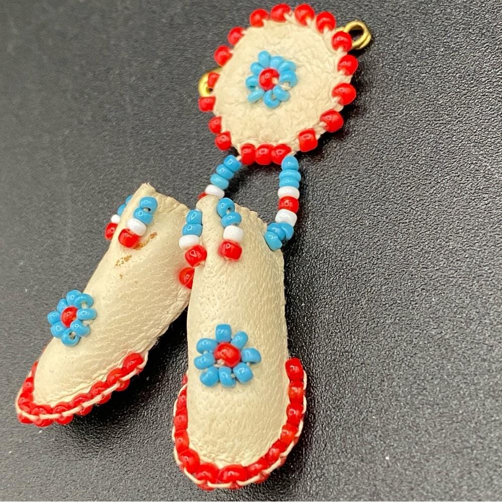 Indigenous vintage 1990s pin/broach with intricate bead work on soft leather. Vintage Yukon Hand Beaded First Nations Leather Brooch - Etsy main image 3