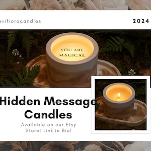 May include: A lit candle in a gray and brown container with the text "YOU ARE MAGICAL". The candle sits on a decorative tray. The image also includes the text "Hidden Message Candles" and "2024".