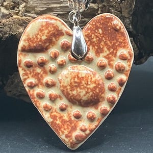 Handmade porcelain ceramic necklace pendant , heart shaped