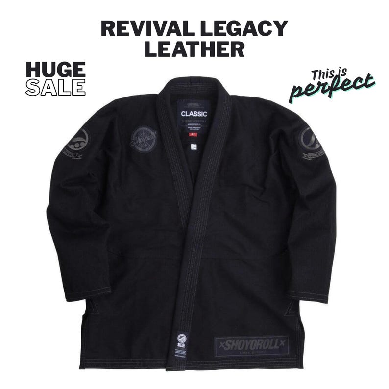 May include: Black martial arts gi with the text "REVIVAL LEGACY LEATHER" and "HUGE SALE". The gi has patches on the sleeves and chest, and the brand name "SHOYOROLL" is visible on the bottom. The gi is a classic design.