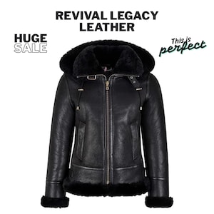 May include: Black leather jacket with a faux fur-lined hood and trim. The jacket features a zipper closure, pockets, and decorative buckles. The text "REVIVAL LEGACY LEATHER" is displayed at the top. The text "HUGE SALE" is displayed on the left.