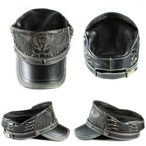 May include: A black leather cap with a skull and wings design. The cap has a brim and a strap with a buckle. The cap is made of genuine leather and has a distressed look.
