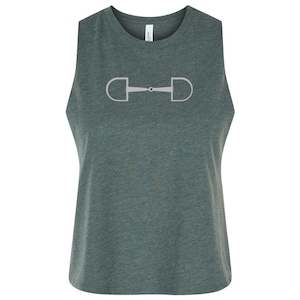May include: A sleeveless, forest green crop top featuring a silver-colored horse bit design. The top has a crew neck and is made of a soft, comfortable material. This equestrian-themed top is perfect for casual wear or the gym.