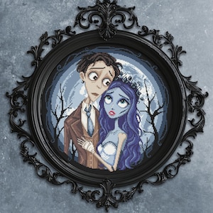 May include: A framed cross-stitch artwork featuring a couple with pale skin and large eyes, set against a moonlit forest backdrop. The black ornate frame adds a gothic touch to the piece. The artwork is a unique home decor item.