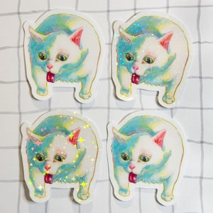 May include: Four stickers featuring a distressed cat illustration. The cat has a white face, blue and yellow fur, and a red tongue sticking out. Some stickers have holographic star accents.