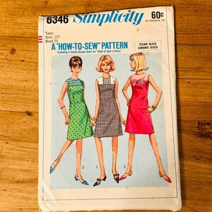 May include: Vintage Simplicity sewing pattern 6346. The pattern features illustrations of three dresses: a green polka dot dress, a black and white checkered dress, and a pink dress with a bow. The pattern includes sizes for teens and juniors.