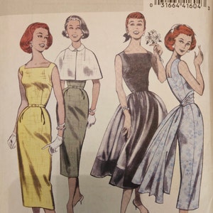 May include: Vintage Butterick sewing pattern B5032 featuring four retro dress designs. The illustration shows women in dresses with varying styles, including a yellow sheath dress, a cape dress, and a full skirt dress. The pattern is from the Retro '52 collection.