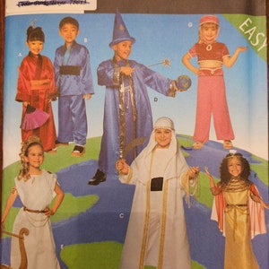 May include: Simplicity Costumes pattern featuring children's costumes. The costumes include a wizard, geisha, Roman, and Arabian styles. The pattern is for sizes A, S, M, and L. The word "EASY" is in the upper right corner.