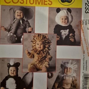 May include: A McCall's Costumes sewing pattern envelope labeled MP233 featuring Tom Arma designs. The yellow and white packaging displays five infant costumes: a gray elephant, a black and white panda, a tan lion, a black skunk, and a brown monkey.
