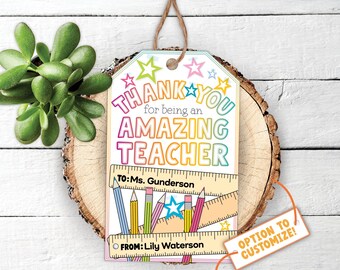 May include: A colorful teacher appreciation gift tag with the message "THANK YOU for being an AMAZING TEACHER." The tag includes a ruler and pencil design, with space to customize the recipient and sender's names. A small tag says "OPTION TO CUSTOMIZE!"