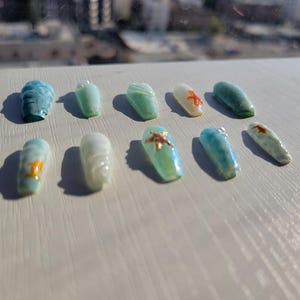 Arte em unhas com tema fundo do mar