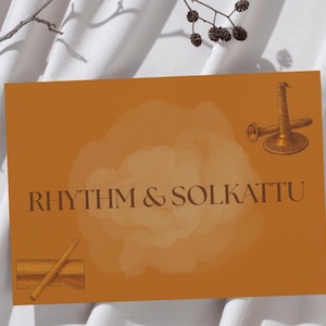 May include: An orange card with the text "RHYTHM & SOLKATTU". The card features illustrations of a musical instrument and a drumstick. The background is a soft, blurred design. The card is set against a white, textured backdrop.