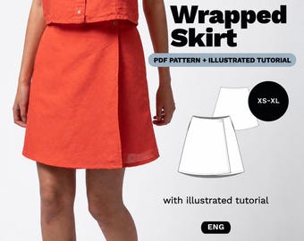 May include: A bright orange wrap skirt with a button closure, presented as a PDF pattern and illustrated tutorial. The text reads Wrapped Skirt, PDF PATTERN + ILLUSTRATED TUTORIAL, XS-XL, with illustrated tutorial, and ENG. The design shows a line drawing.